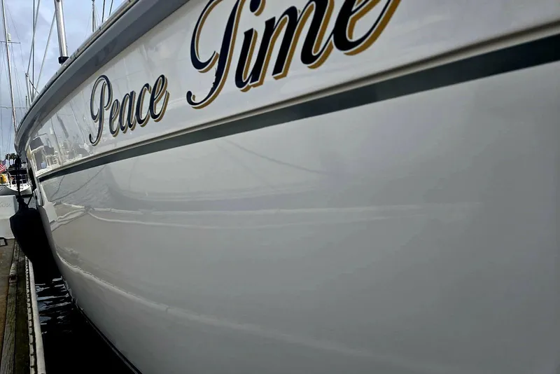 2012 Hunter 36 sailboat named "Peace Time" docked at marina.
