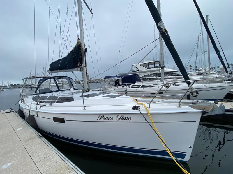 2012 Hunter e36 sailboat named Peace Time docked at a marina.