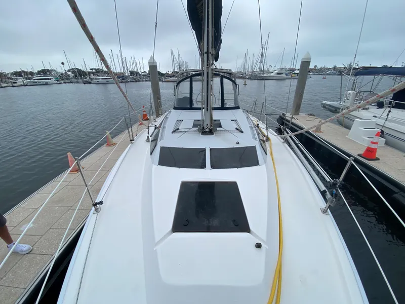 2012 Hunter e36 sailboat docked at marina with overcast sky.