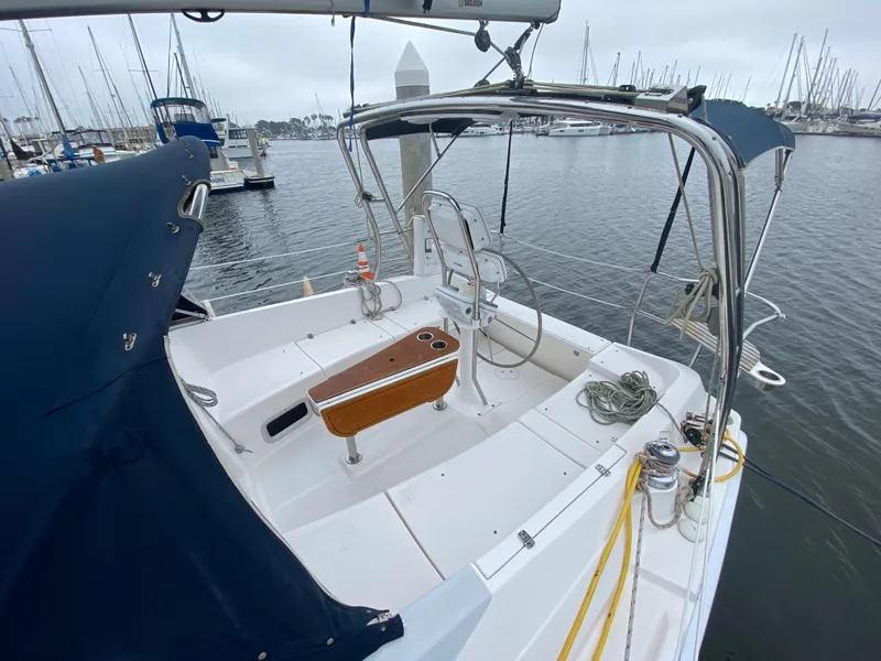 Cockpit view of a 2012 Hunter e36 sailboat docked at a marina.