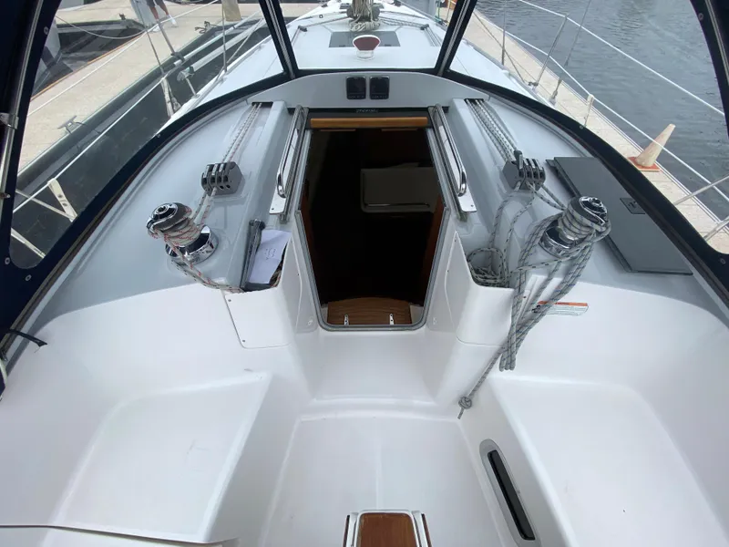Cockpit of 2012 Hunter e36 sailboat with winches and entry to cabin.