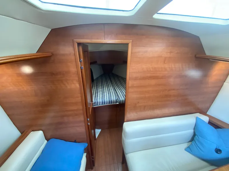 Interior of 2012 Hunter e36 sailboat with cozy cabin and seating area.