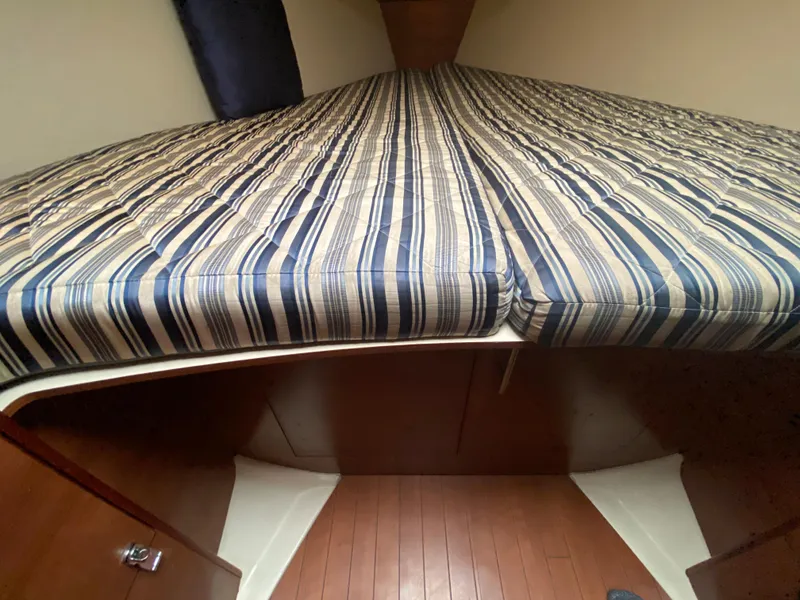 2012 Hunter e36 boat interior with striped mattress in cabin.