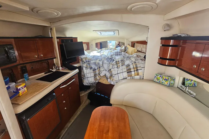 Interior of 2005 Sea Ray 300 Sundancer with cozy cabin and modern amenities.