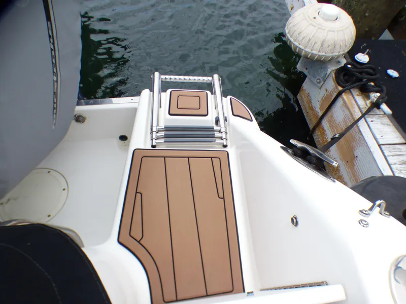 2004 Robalo R265 Walkaround boat stern with swim platform and ladder.
