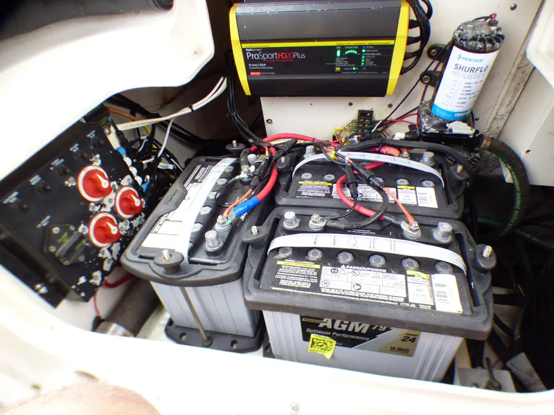 Electrical system of a 2004 Robalo R265 Walkaround boat with batteries and charger.
