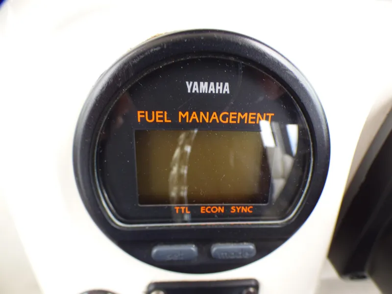Yamaha fuel management display on 2004 Robalo R265 Walkaround boat dashboard.