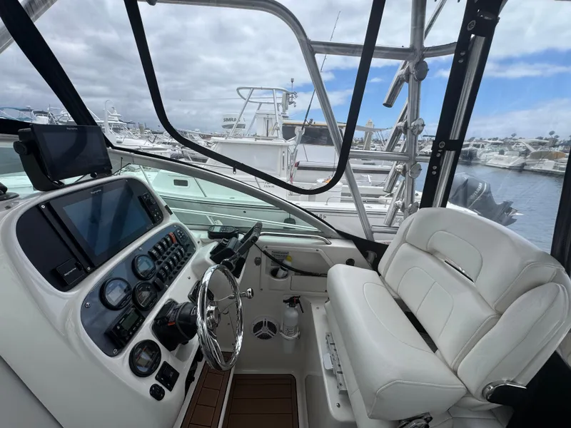 2004 Robalo R265 Walkaround boat interior with steering wheel and control panel.