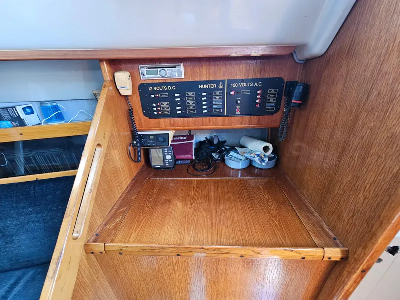 Interior view of a 1988 Hunter Legend 35 sailboat with control panel.