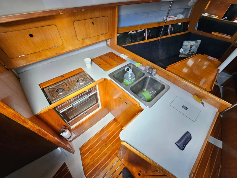 Interior of 1988 Hunter Legend 35 yacht with kitchen and sink.