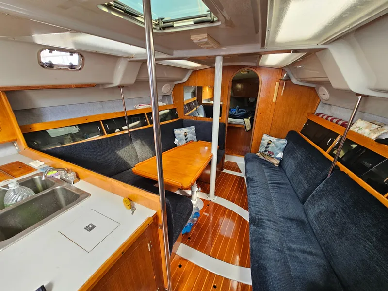 Interior of a 1988 Hunter Legend 35 yacht with wooden furnishings.