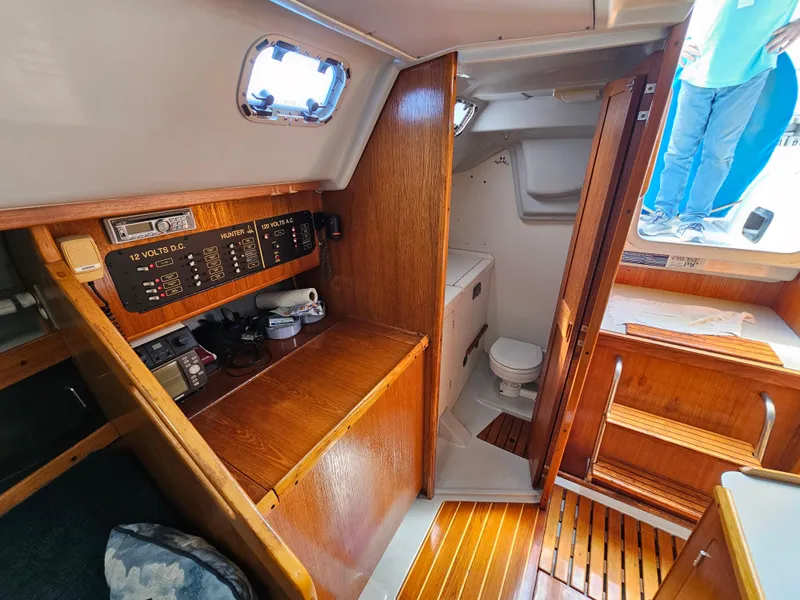 Interior of a 1988 Hunter Legend 35 yacht with wooden furnishings.