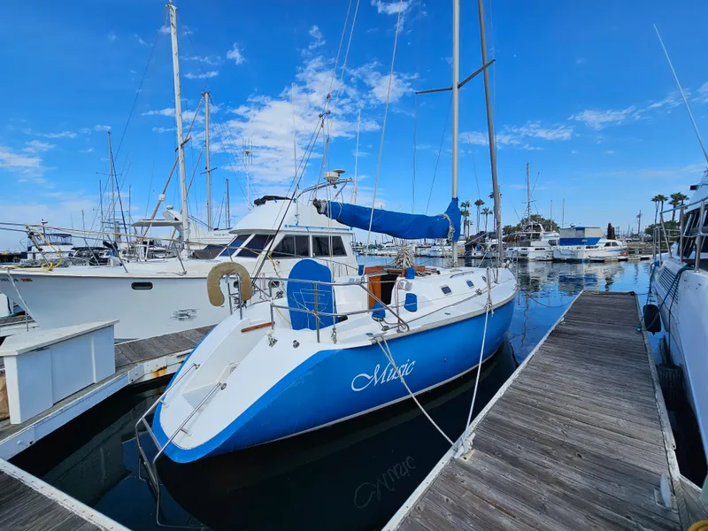 1988 Hunter Legend 35 sailboat docked in marina.
