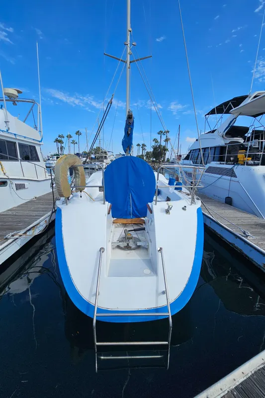 1988 Hunter Legend 35 sailboat docked in marina.