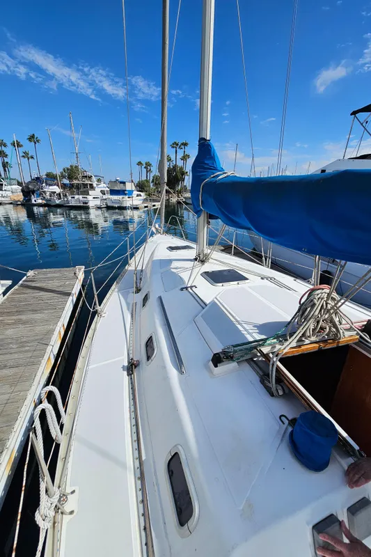1988 Hunter Legend 35 sailboat docked in marina.