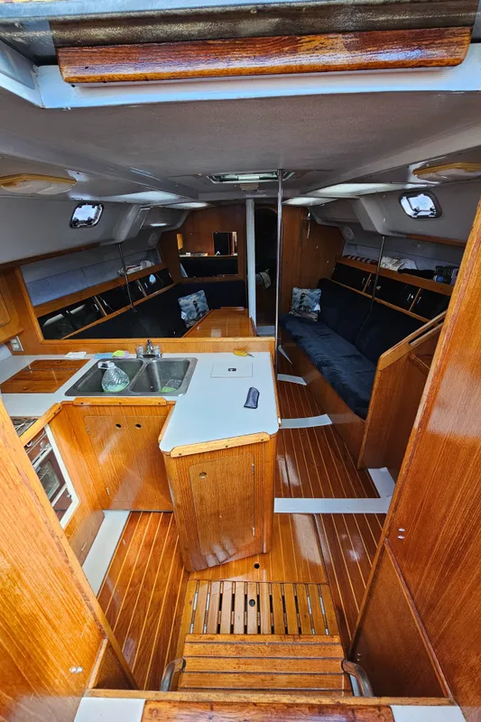 Interior of 1988 Hunter Legend 35 sailboat with wooden finishes.