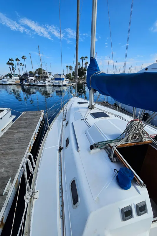 1988 Hunter Legend 35 sailboat docked in marina.