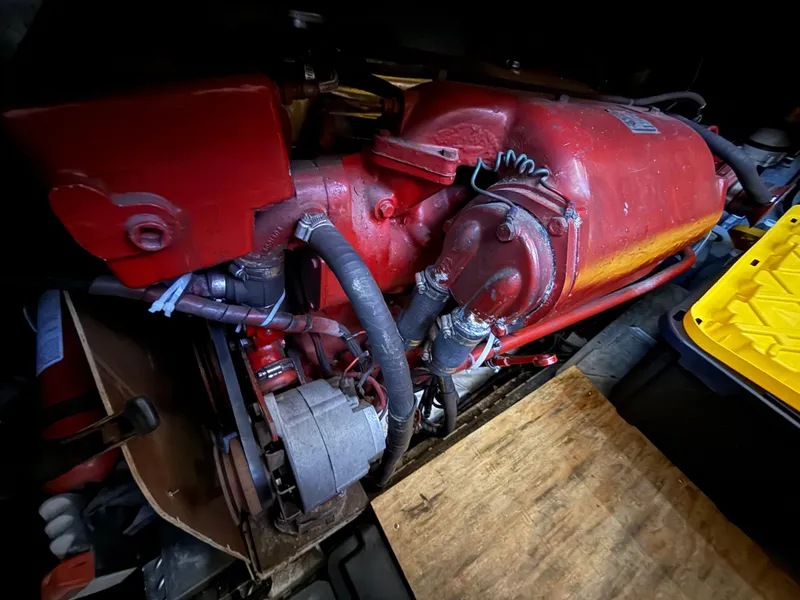1986 Kha Shing Nautique engine, red and yellow components, detailed view.