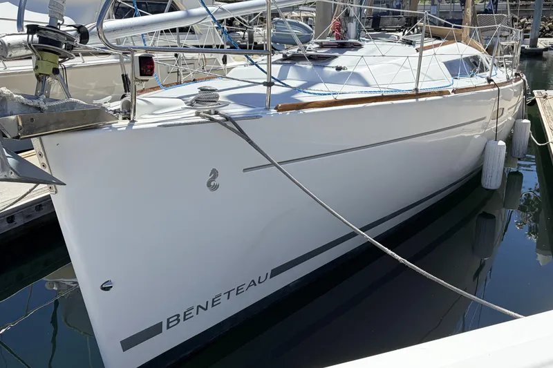 2010 Beneteau Oceanis 37 sailboat docked in marina, side view.