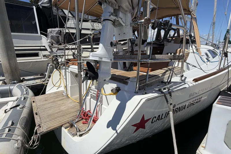2010 Beneteau Oceanis 37 sailboat docked, featuring a spacious deck and modern design.