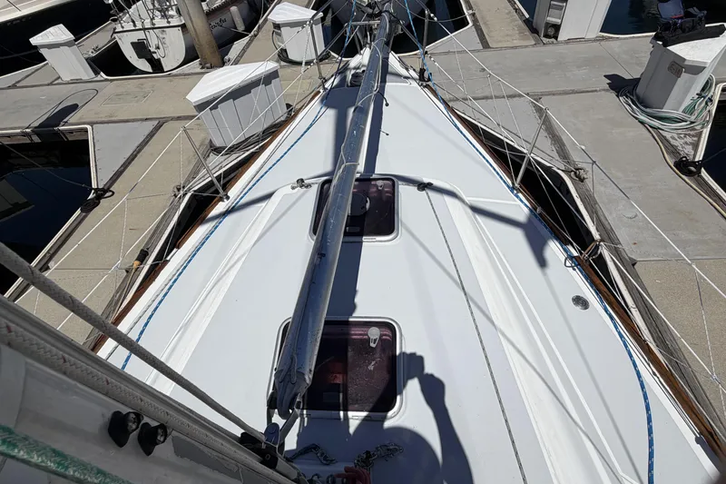 2010 Beneteau Oceanis 37 sailboat docked, showcasing deck and rigging details.