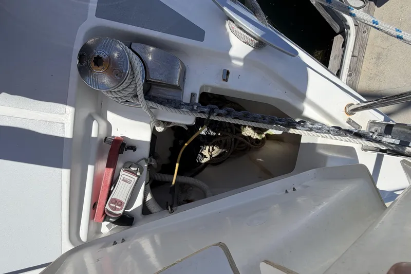 Anchor locker and winch on a 2010 Beneteau Oceanis 37 sailboat deck.