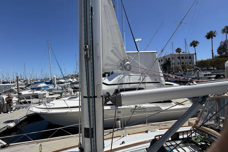 Beneteau Oceanis 37 sailboat docked at marina, clear blue sky, 2010 model.