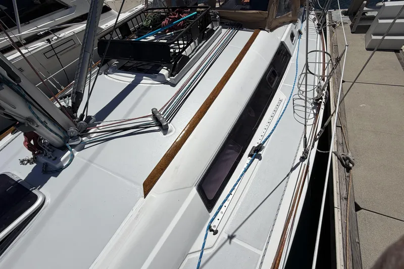 Beneteau Oceanis 37 sailboat, 2010 model, docked with visible deck and rigging.