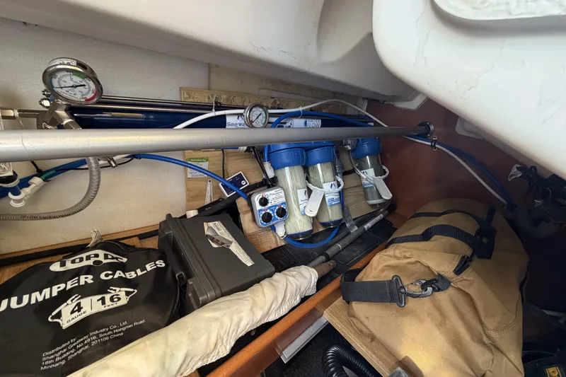 Storage compartment of a 2010 Beneteau Oceanis 37 with water filtration system.