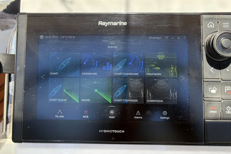 Raymarine HybridTouch display on 2010 Beneteau Oceanis 37, showing navigation and fishfinder options.