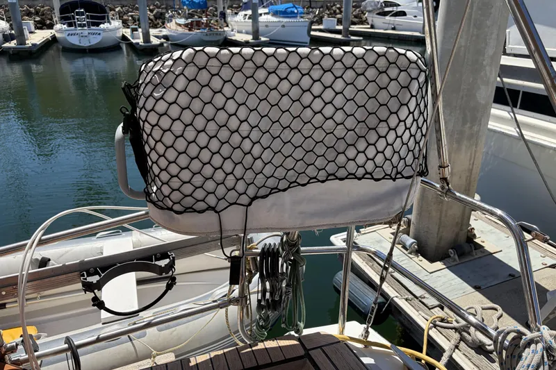 Beneteau Oceanis 37 sailboat helm with protective cover, docked at marina, 2010 model.