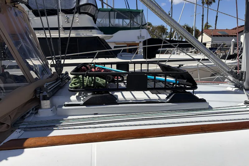 Deck of 2010 Beneteau Oceanis 37 sailboat with ropes and equipment.