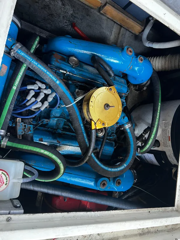1982 Carver Mariner 33 engine compartment with blue and yellow components.
