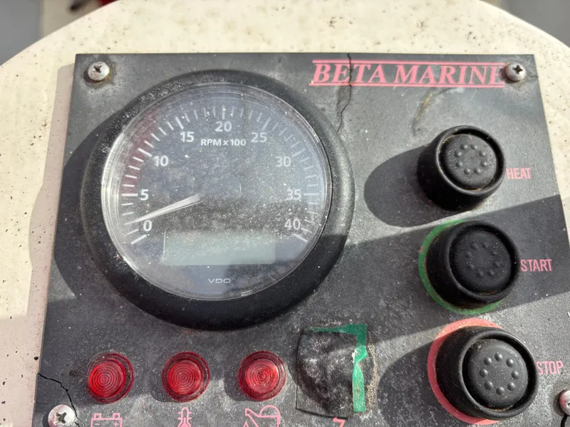 Beta Marine control panel with RPM gauge and buttons on a 1975 Thomas Colvin schooner.