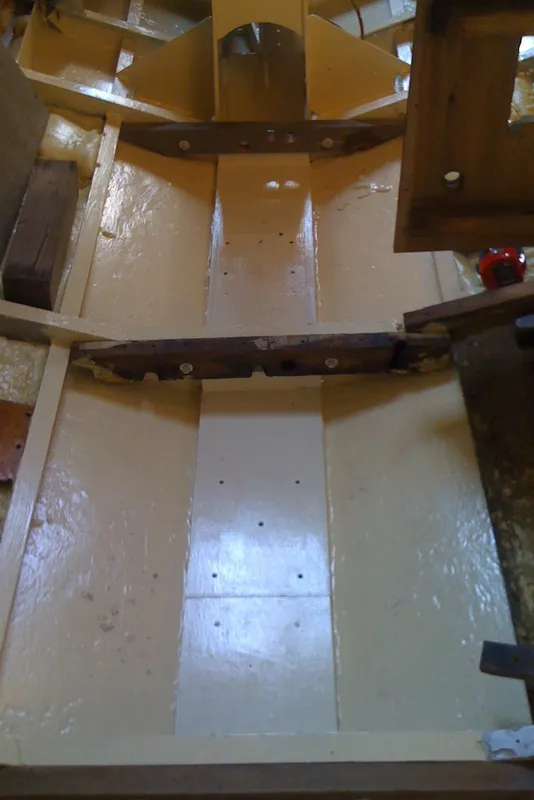 Interior view of 1975 Custom 45’ Thomas Colvin “Tamarack” Schooner, showcasing wooden structure and design.