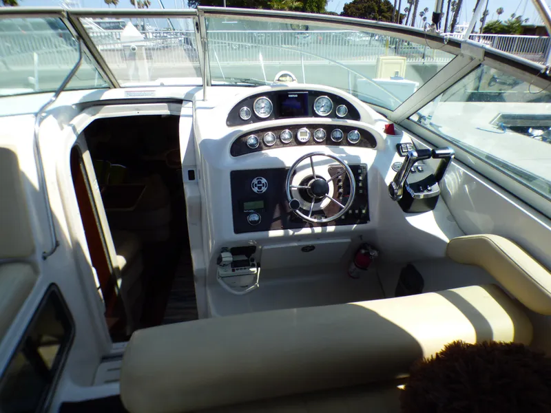 2001 Monterey 302 Cruiser cockpit with steering wheel and control panel.
