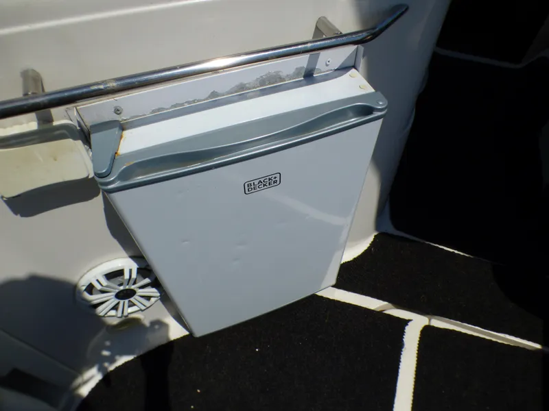Mini fridge on 2001 Monterey 302 Cruiser boat deck, with Black & Decker logo.