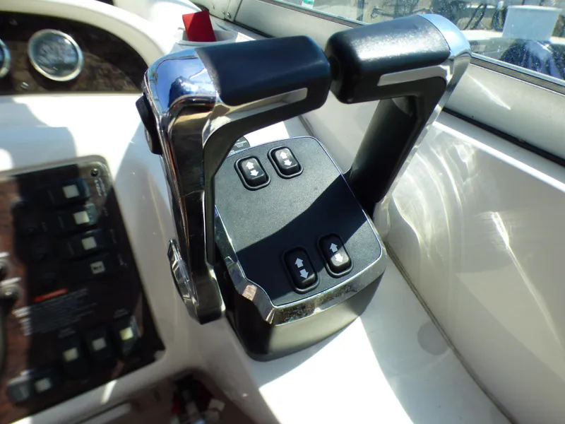 Throttle controls on a 2001 Monterey 302 Cruiser boat dashboard.
