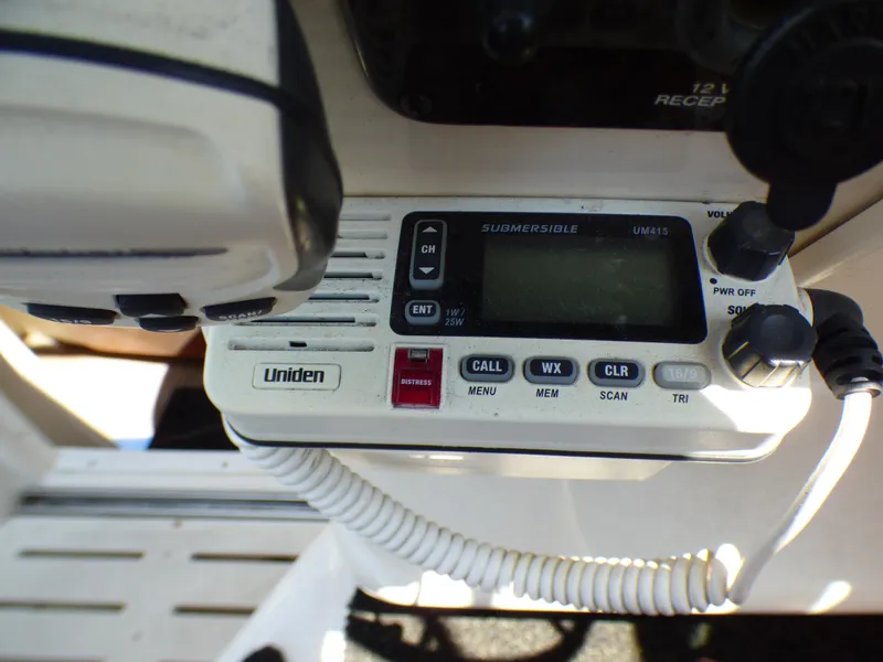 Uniden marine radio on 2001 Monterey 302 Cruiser boat dashboard.