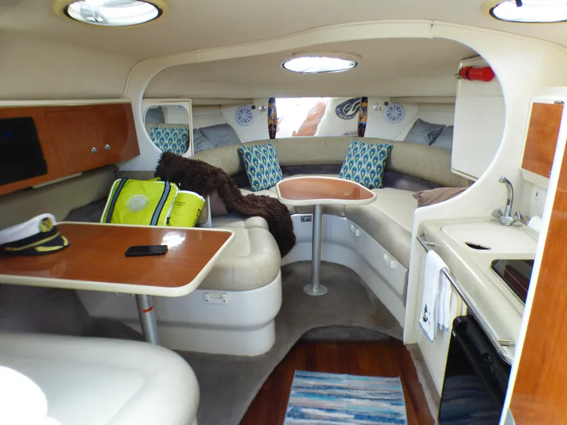 Interior of a 2001 Monterey 302 Cruiser with seating, table, and kitchenette.