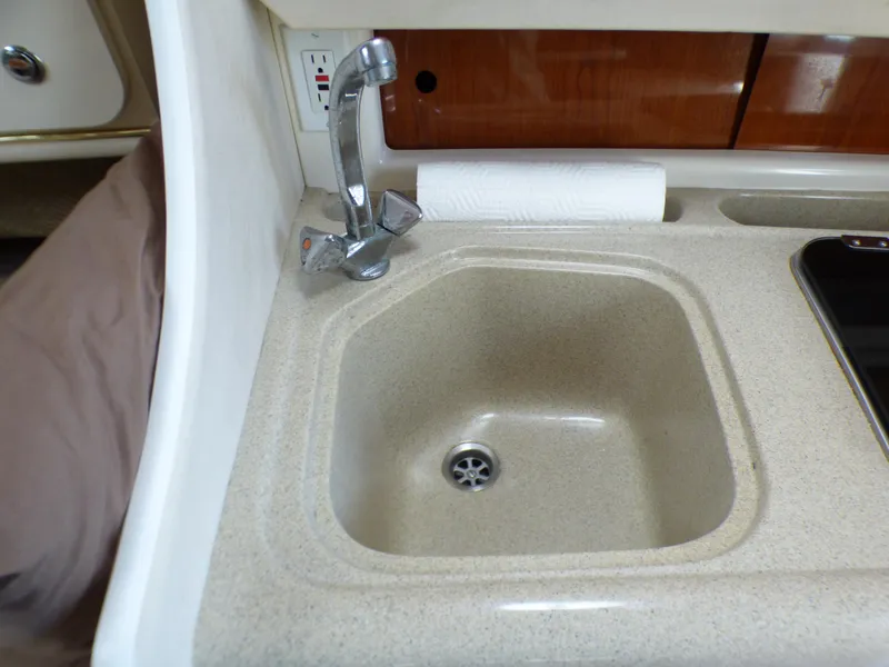 Small sink in 2001 Monterey 302 Cruiser boat interior.