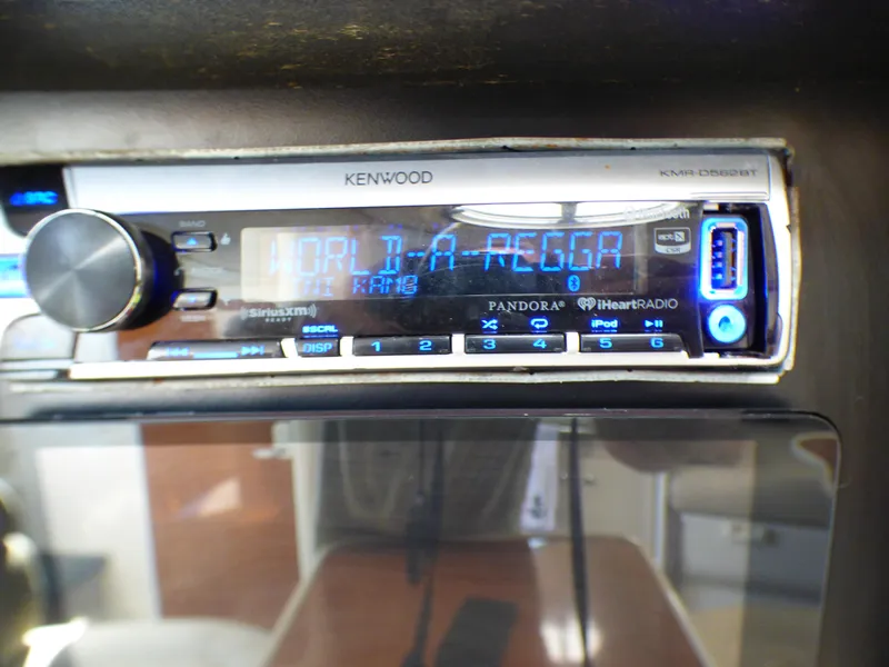 Kenwood stereo system in 2001 Monterey 302 Cruiser displaying "World-A-Regga".