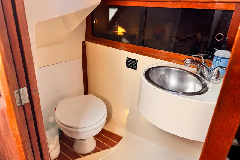 1979 O'Day 37 Center Cockpit bathroom with toilet and sink.