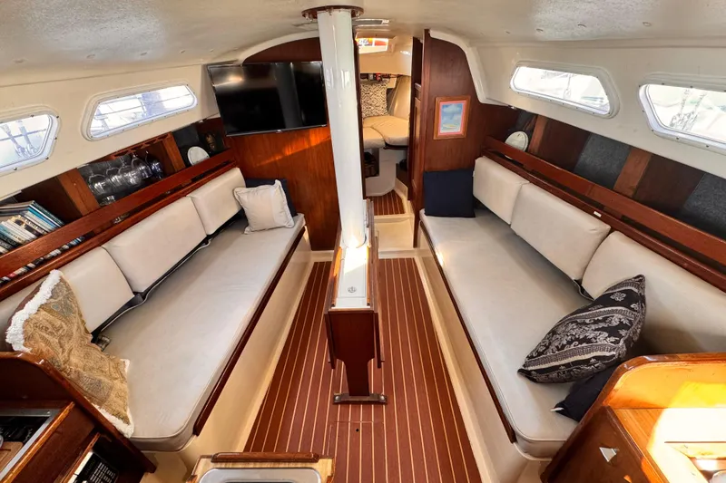 1979 O'Day 37 Center Cockpit interior with cozy seating and elegant wood finish.