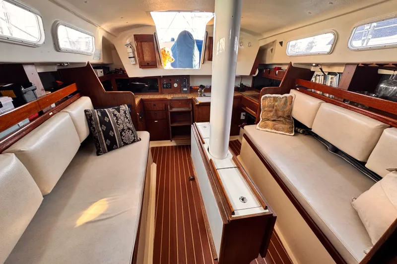 Interior of 1979 O'Day 37 Center Cockpit sailboat with cozy seating and wooden accents.