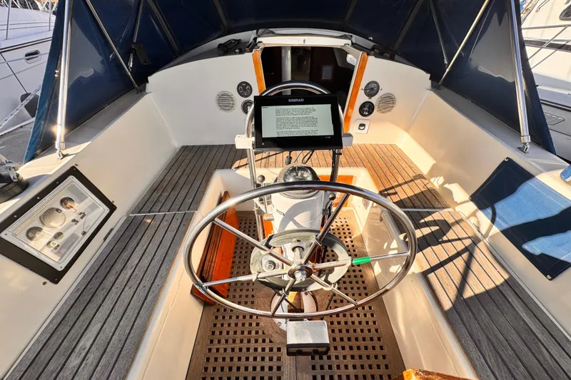 1979 O'Day 37 Center Cockpit with steering wheel and navigation equipment.