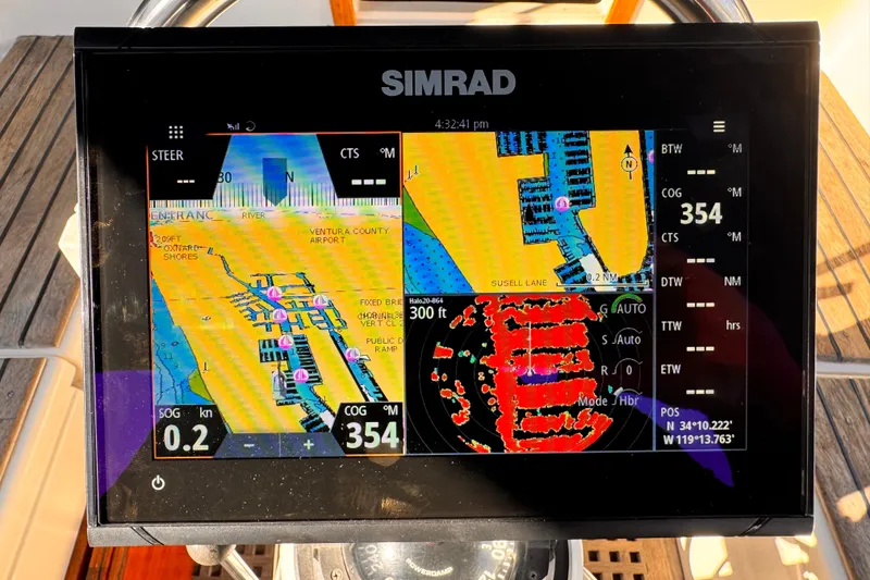 Simrad navigation display on 1979 O'Day 37 Center Cockpit sailboat, showing nautical charts and radar.