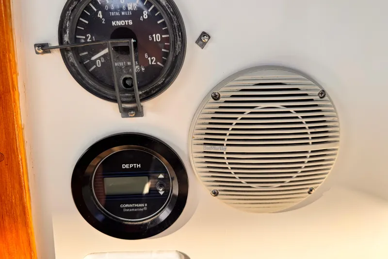 1979 O'Day 37 Center Cockpit instruments: speedometer, depth gauge, and speaker.