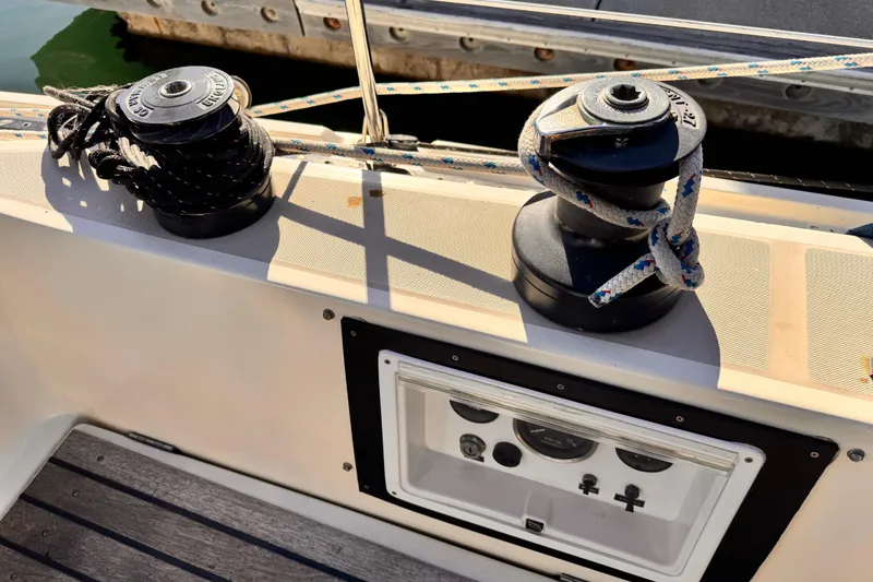 Winches and ropes on a 1979 O'Day 37 Center Cockpit sailboat deck.