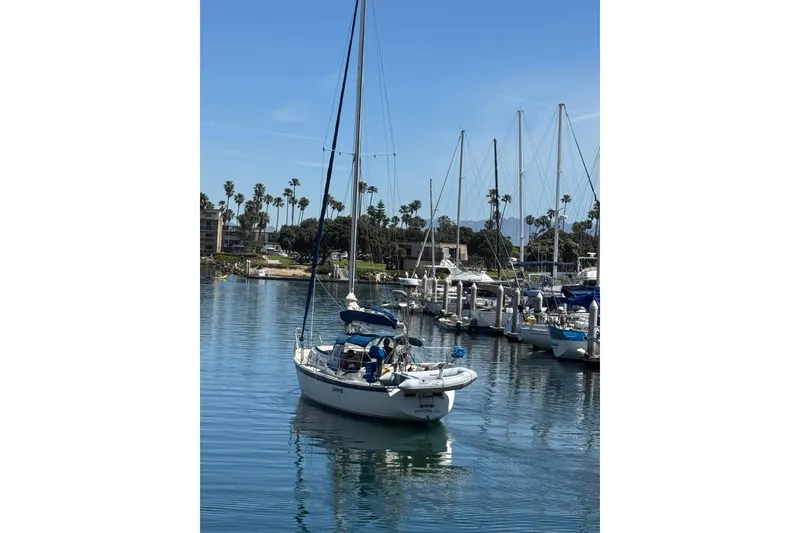 1979 O'Day 37 Center Cockpit sailboat docked in a sunny marina.